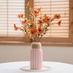 décoration extérieure anniversaire fleurs artificielles vases pots modernes rouges orangées jaunes