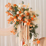 arche décorative boho chic fleurs artificielles orange feuilles vertes franges blanches extérieur mariage anniversaireévénement