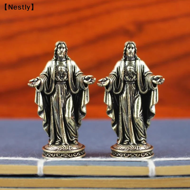 statuette religieuse argentée détail sculpté classique figure humaine vêtements larges base décorative