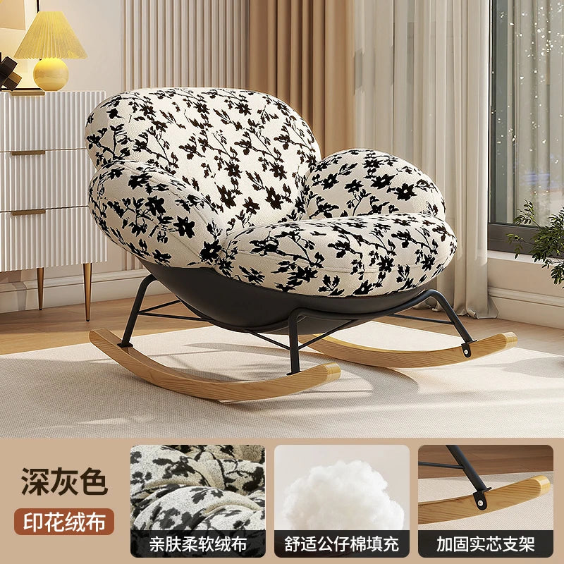 fauteuil bascule moderne beige noir orange roulettes coussin repos minimaliste salon
