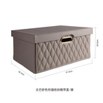 boîte rangement cuir matelassé poignées métalliques chambre moderne