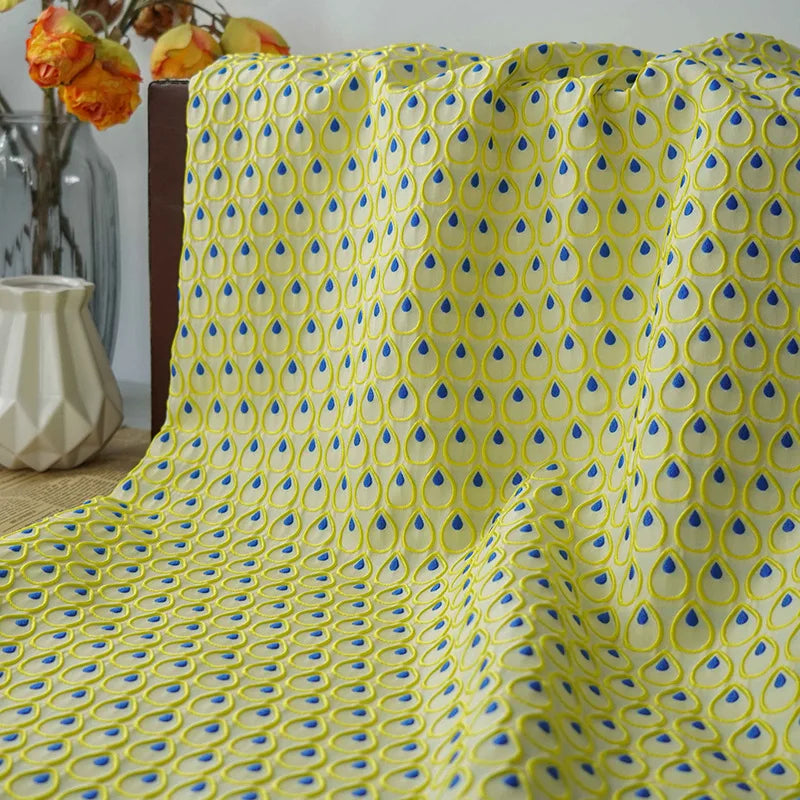 tissu polyester jaune bleu motif gouttes plumes decoratif moderne largeur 150cm graphique Jacquard