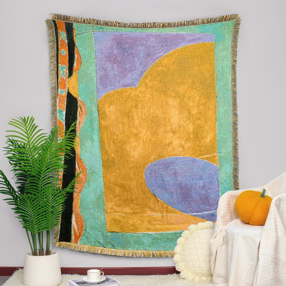 Couverture murale en tissu coloré avec des formes géométriques abstraites dans des tons pastel et vifs, créant une composition moderne et dynamique.