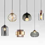 suspension lumineuse moderne transparente dorée ampoule câble noir minimaliste salle manger chambre