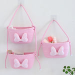 panier rangement rose blanc rayures horizontales noeud décoratif réutilisable polyestère enfantin cordelette organisation jouets
