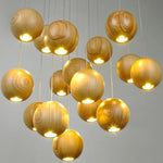 luminaire suspension bois massif moderne éclairage intérieur salon cuisine restaurant naturel