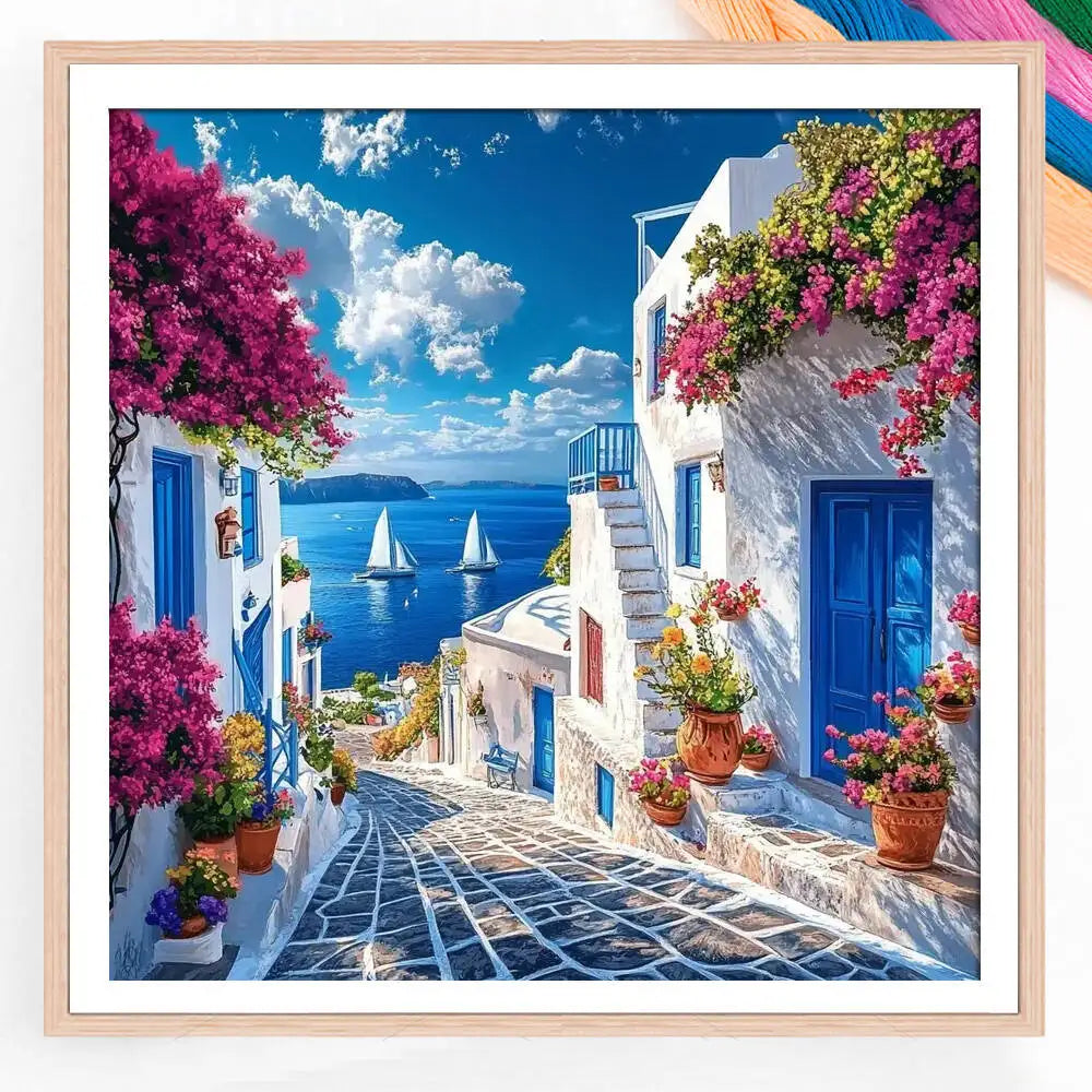 broderie paysage marin maisons blanches fleurs ciel bleu nuages artisanal traditionnel aiguilles fils instructions
