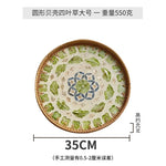 plateau rond rotin coquillages feuilles naturelles décoration boho assiette fruits pain petit déjeuner