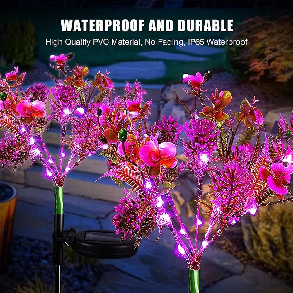 Lampe solaire jardin décorative orchidée allumée nuit