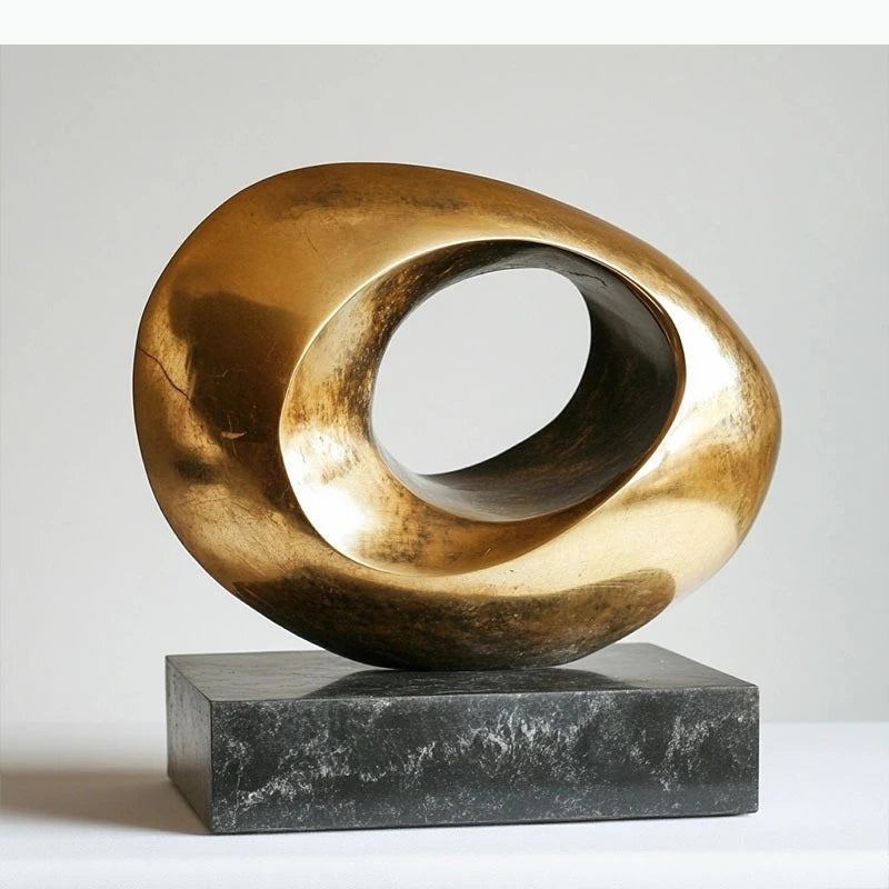 Sculptures abstraites métal doré modernes minimalistes socle noir texturées lumineuses