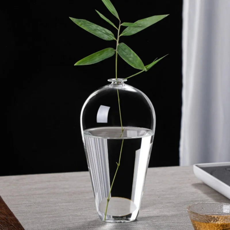 vases verre transparent modernes élégants branches feuilles roses arrangements floraux table maison mariage