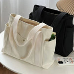 sac main toile beige clair poches poignées détachables moderne casual