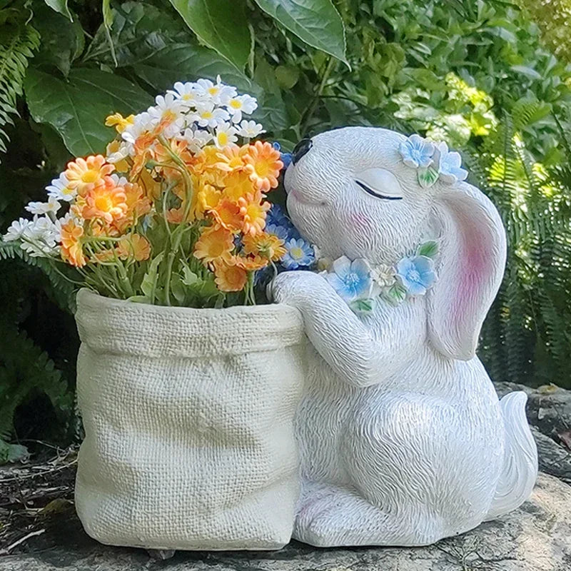 Statues lapins décoratifs fleurs artificielles blanc rose bleu texture fourrure