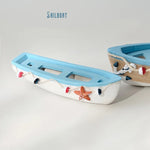 décoration maison bateau bois motif marin coquillages étoiles mer bleu blanc rouge
