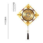 horloge murale or noir motif géométrique tissu classique tassel moderne