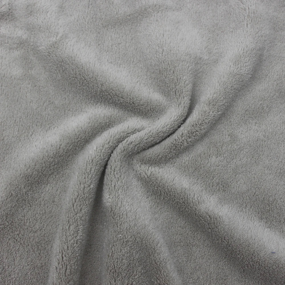 Texture floue et soyeuse d'un tissu gris chiné.