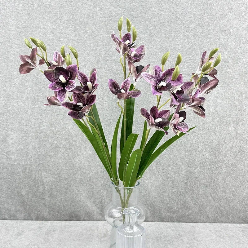 bouquet fleurs artificielles orchidées cymbidium roses blanches violettes jaunes décoration intérieure maison moderne minimaliste