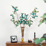 vase verre ambré motif moucheté moderne décoration intérieure bougie papillon fleurs violettes chandelier