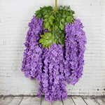 guirlande fleurs artificielles violettes blanches roses feuilles vertes extérieur moderne décoration branches accrochéesextérieur exposition