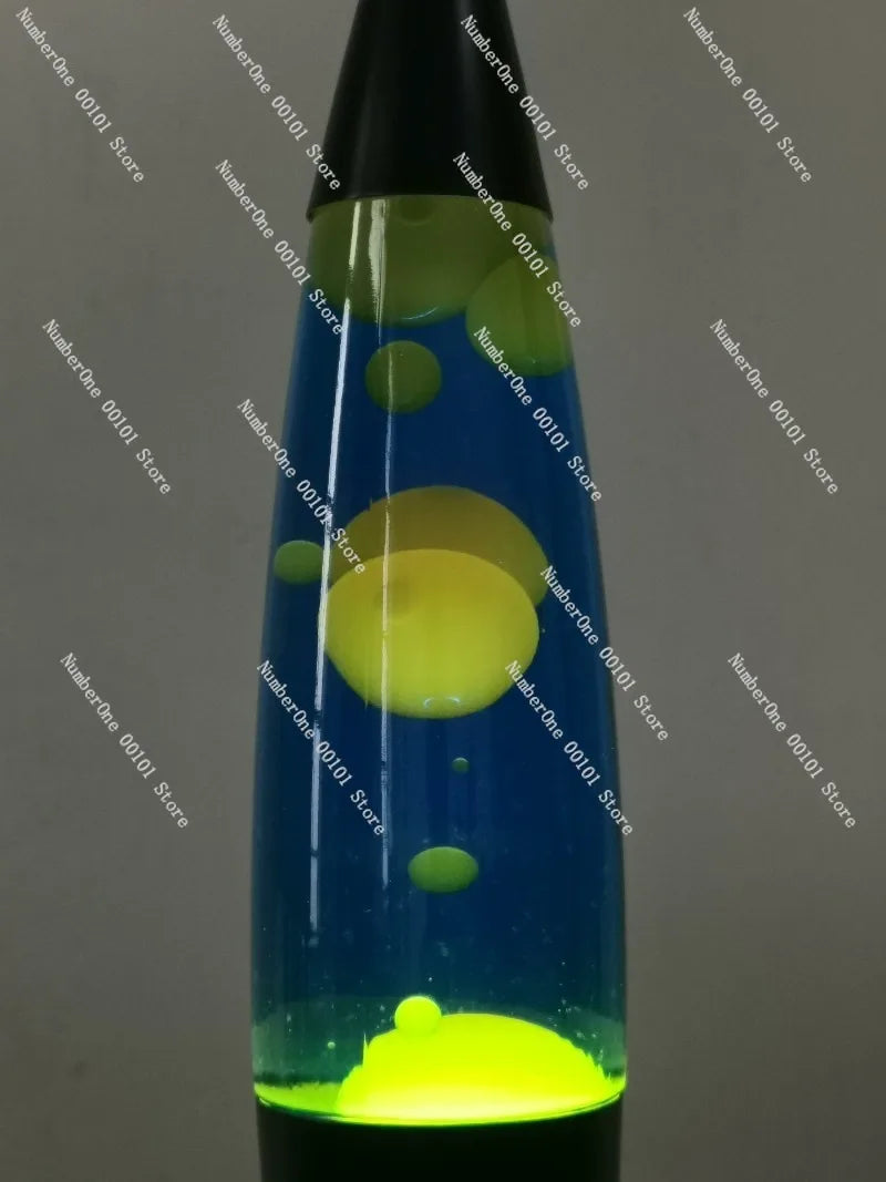lampe lava bleu vert noir liquide formes flottantes transparent rétro psychédélique