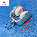 rouleaux rideaux blancs anneaux métalliques modernes quincailleries fixations poulies tringles curseurs roues mat inoxydables