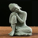 statues bouddha pierre zen minimaliste figurines assises accroupies table bois