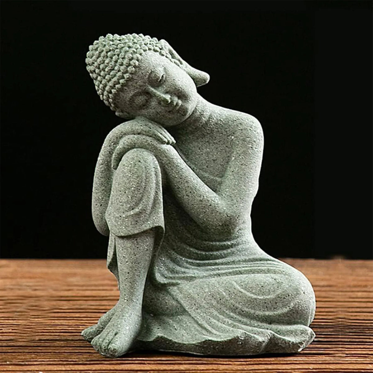 statues bouddha pierre zen minimaliste figurines assises accroupies table bois