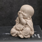 statuettes bouddha enfant résine beige clair marron motifs dorés zen