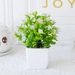 décoration extérieure plante artificielle moderne pot carré blanc branches feuilles vertes fleurs violettes minimalisteextérieur