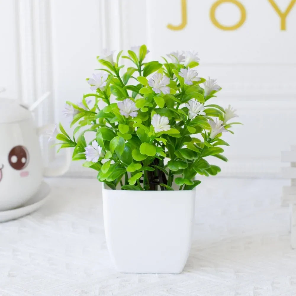 décoration extérieure plante artificielle moderne pot carré blanc branches feuilles vertes fleurs violettes minimalisteextérieur