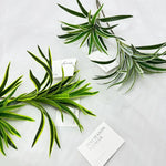 plantes artificielles vertes feuilles fines décoration intérieure moderne branchies striées minimalistes