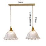 suspension lumineuse vintage vert doré motifs géométriques ampoules câbles chaînes métal