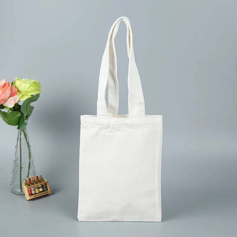 sac main toile réutilisable noir blanc beige classique uni opacité poignées respectueux environnement multifonction