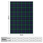Plaid tartan doux plié sur fauteuil