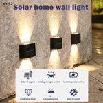 lampe murale solaire noire moderne panneau solaire blanc led extérieure jardin paysage