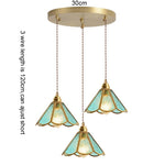 suspension lumineuse verre teinté art deco or marron bleu clair motifs géométriques opacité chaînes