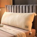 coussin tête lit gris rayures horizontales moderne fixé deux pompons blancs confortable coton polyester