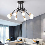 suspension lumineuse moderne noir doré ampoules blanches structure spirale fixation câbles métallique