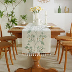 tableau chemin table rustique motifs végétaux franges beige branches feuilles textures tissées bohème