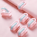 clips rangement moderne rose clair beige vert pastel violet adhésifs minimalistes pièces invisible housse