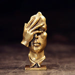 statuette abstraite dorée sculpture visage stylisé moderne décoration salon maison