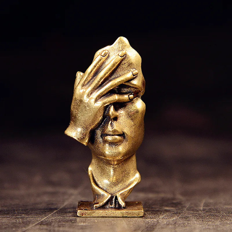 statuette abstraite dorée sculpture visage stylisé moderne décoration salon maison