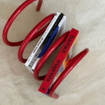supports livres spirales moderne minimaliste rouge bleu rose jaune gris sans motif.surface lisse