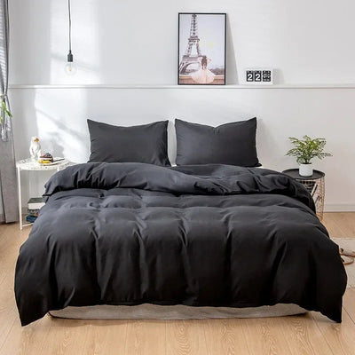 Housse de couette 220x240 uni moderne en polyester sur un lit