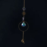 bijou pendentif cristal or bleu violet vert formes géométriques motifs oculaires translucides boho chic