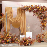 décoration événement mariage arc floral composition feuilles branches rustique automnale