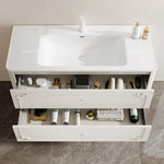 meuble salle bain noir blanc tiroirs vasque ornements dorés classique fixations murales accessoires cosmétiques