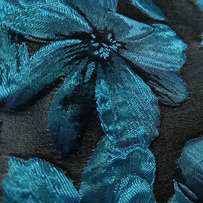 tissu polyester jacinthe fleurs stylisées résistance intempéries largeur 155cm couleurs bleu noir opacité