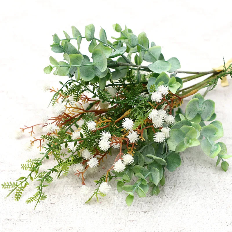 décoration intérieure bouquet artificiel feuilles vertes fleurs blanches jaunes roses naturel salon jardin