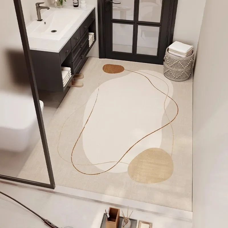 Un sol de salle de bain simple et élégant, avec un motif abstrait beige et blanc, une vanité sombre et un grand miroir, créant une atmosphère épurée et moderne.